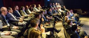 Group of people in auditorium at ClubCIO Live Vote event